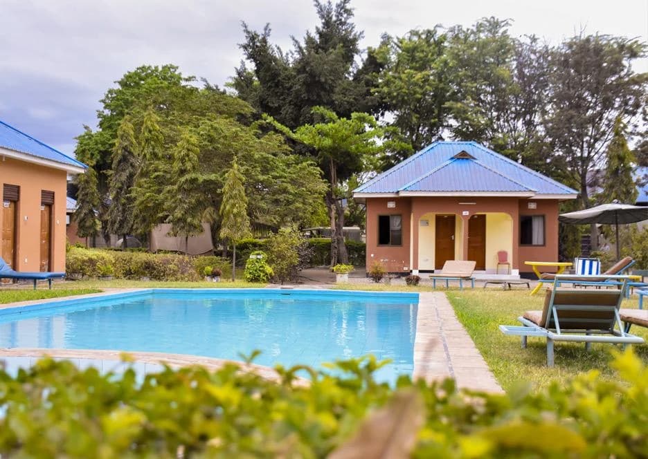 Pool and guest cottages at Fanaka Campsite