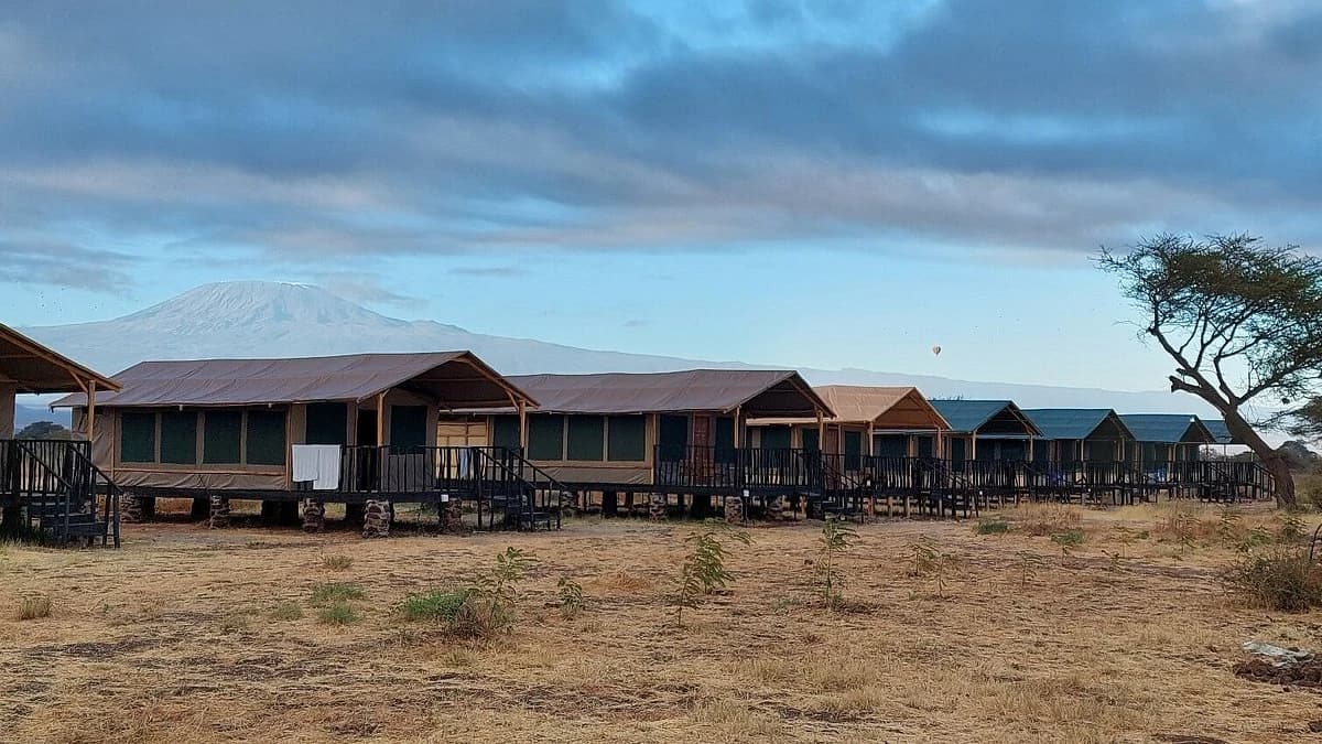 Tents at Nyati Safari Camp in Amboseli, with Kilimanjaro behind